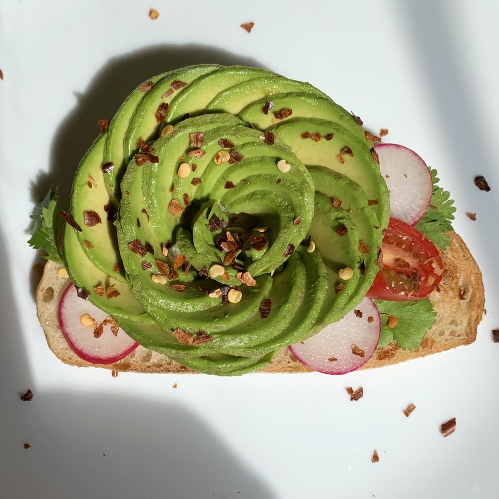 avocado rose toast with radishes and chili flakes