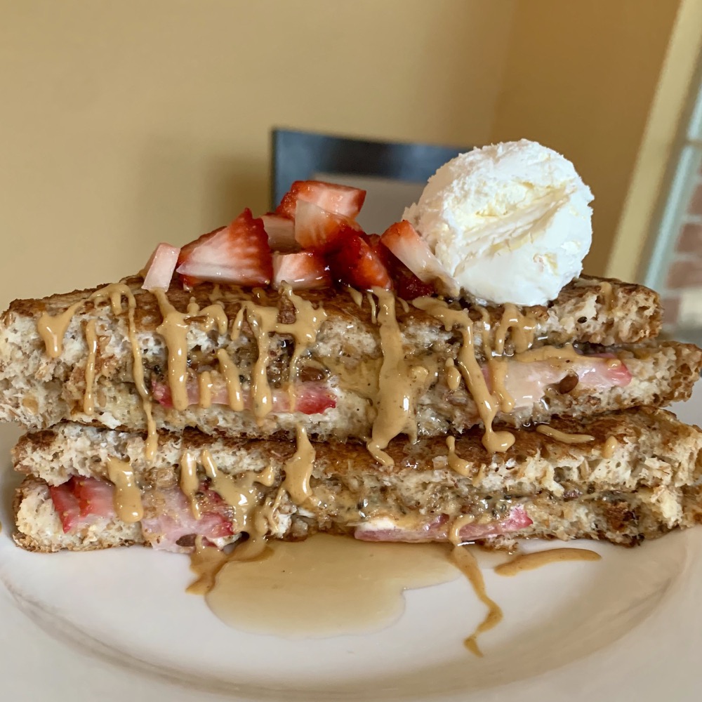 strawberry-stuffed toast with peanut butter drizzle